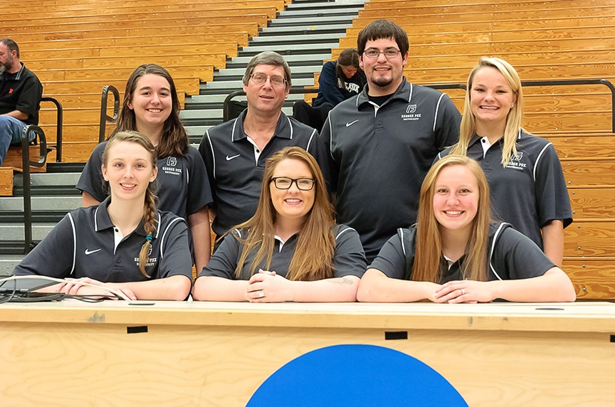 Cash with his student assistant crew during a George Fox women’s volleyball match.